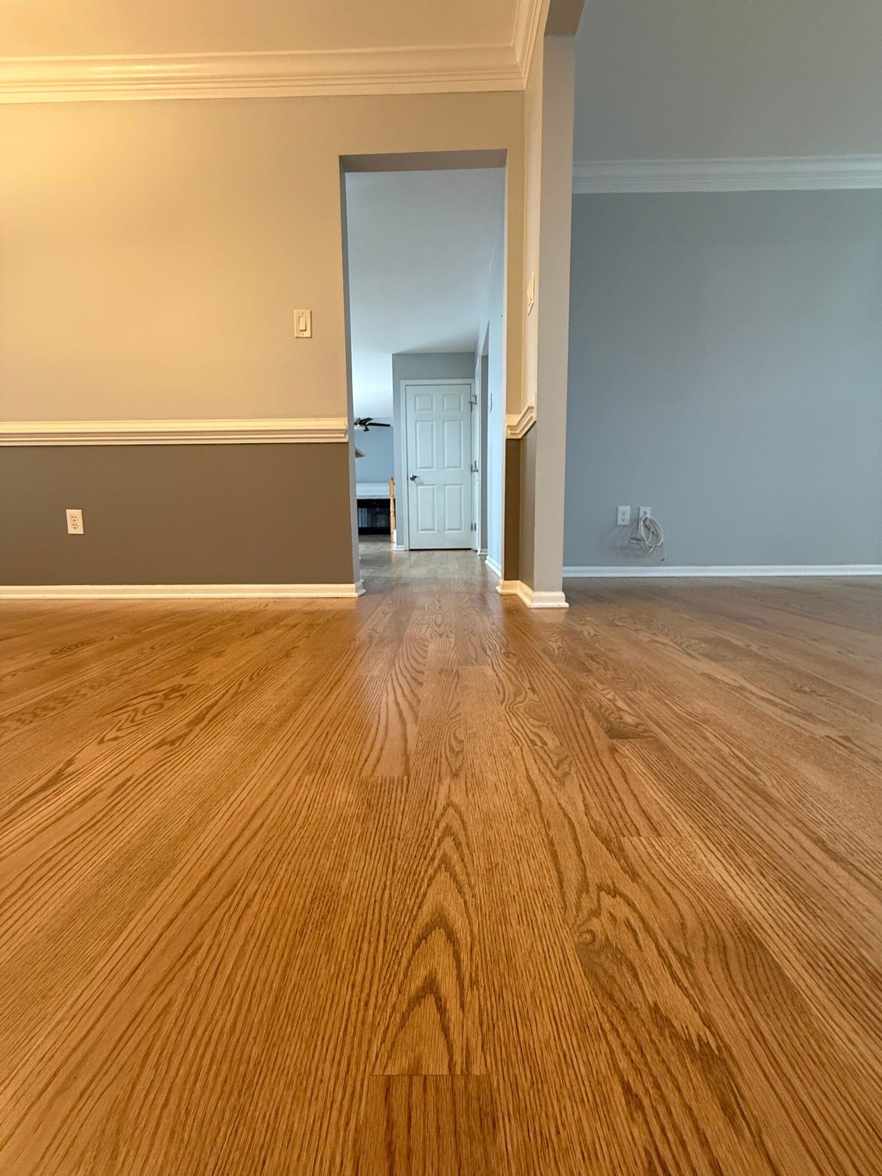 Refinished oak hardwood looking into a dining room